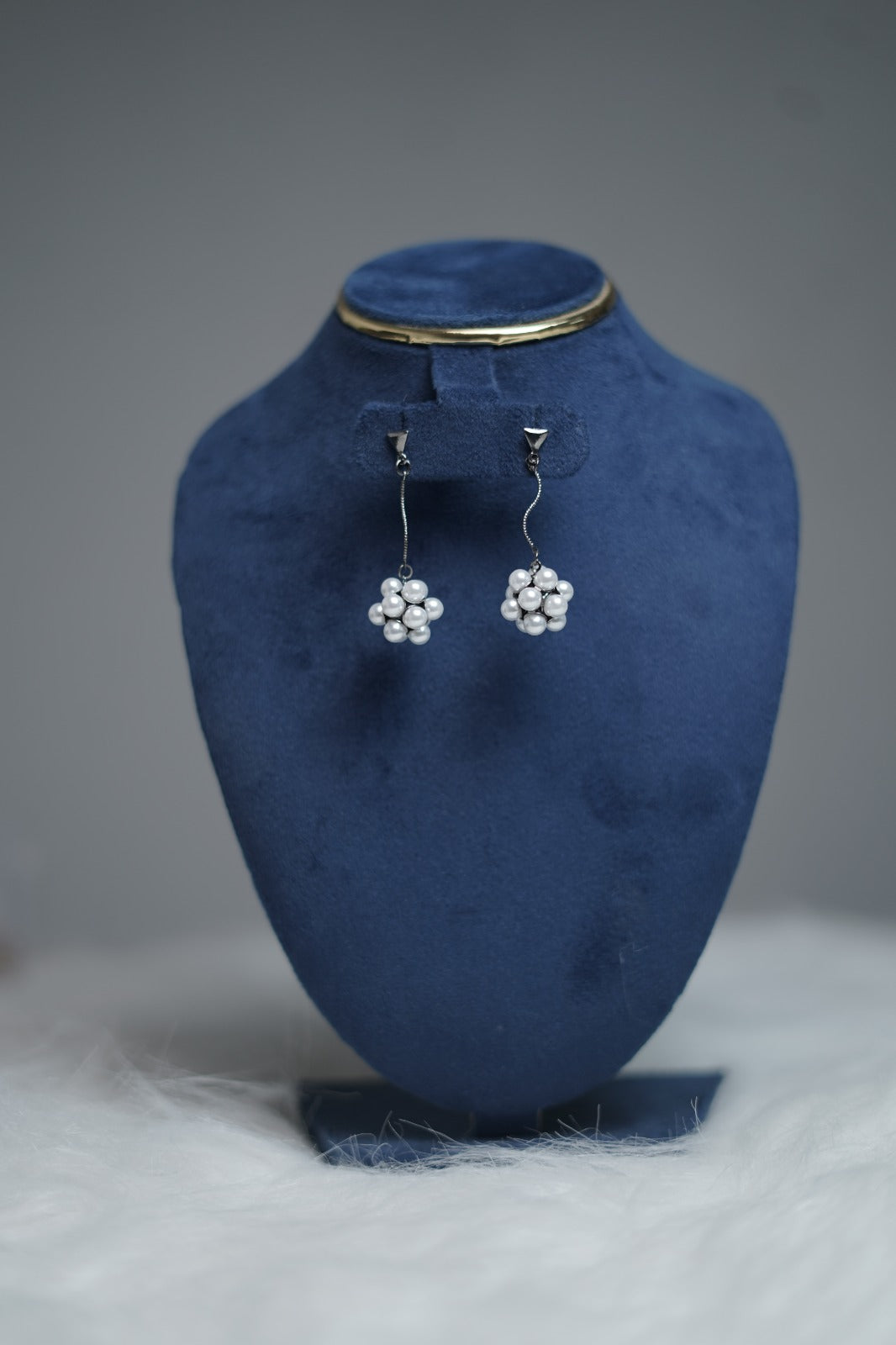 Twilight Pearl Cluster Earrings displayed on minimal earring stand.