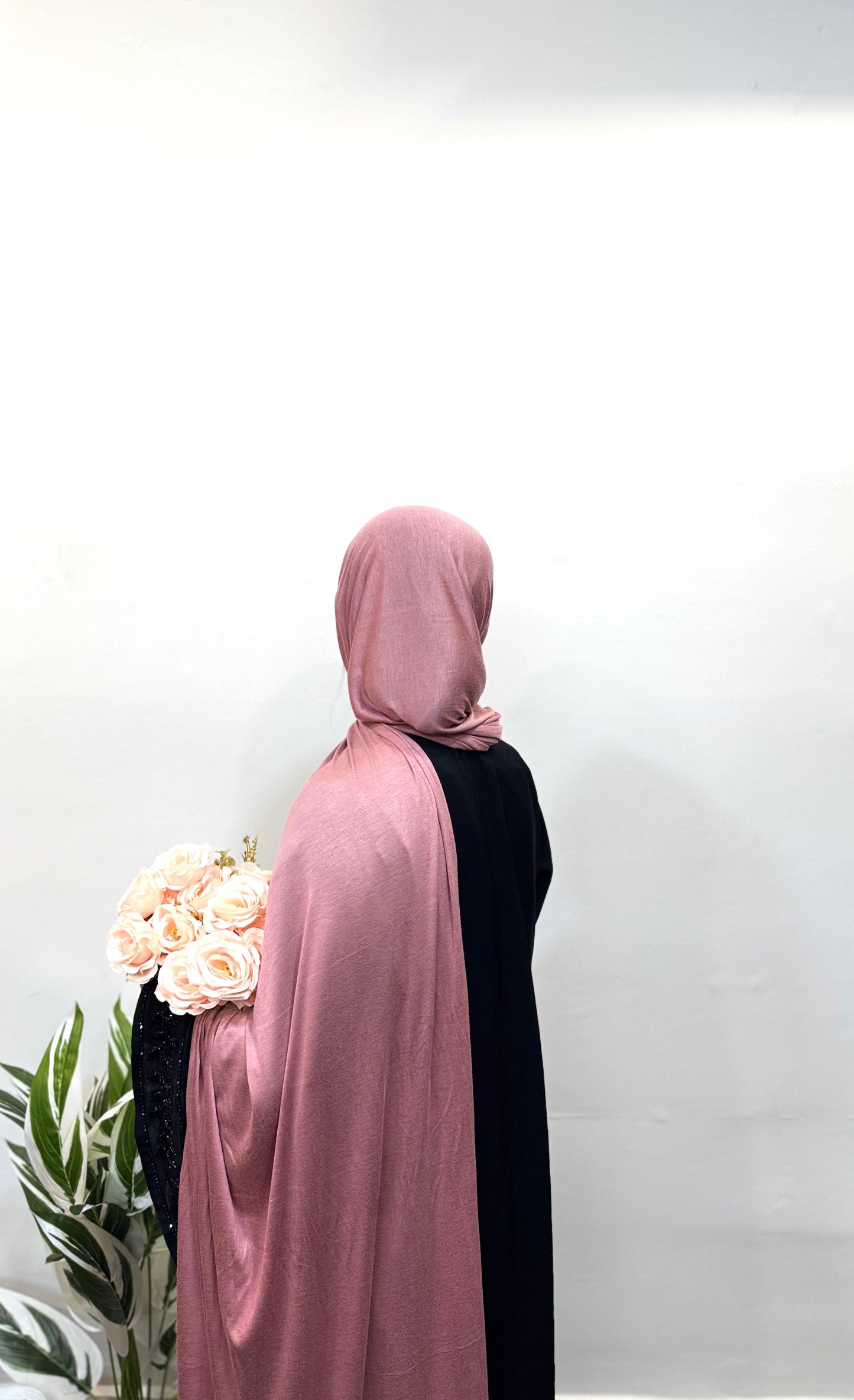 Soft and vibrant watermelon pink jersey hijab for a bright look.