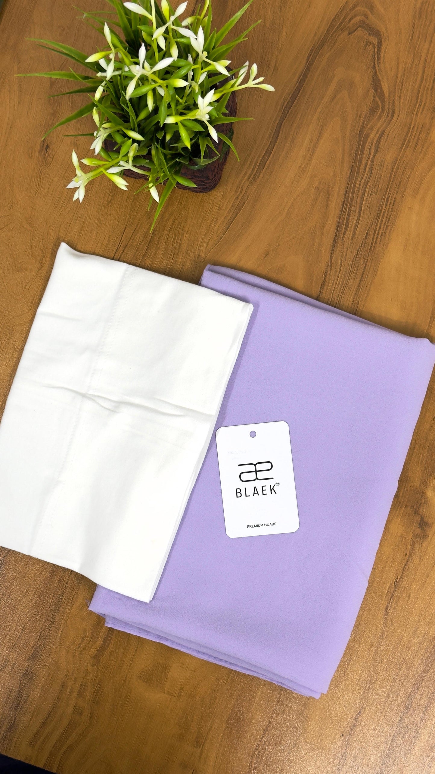 Delicate pastel lavender hijab with a clean white cap for a minimal aesthetic.