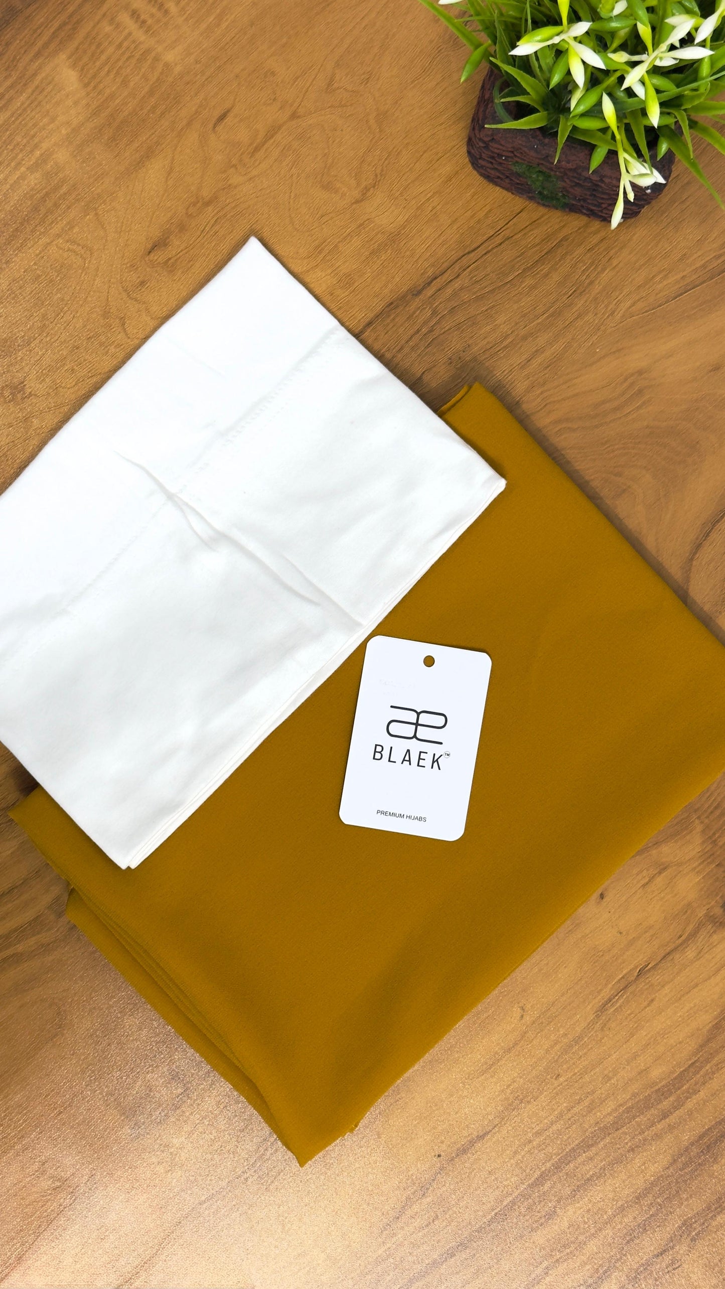 Lightweight mustard hijab with a structured white cap for a polished finish.
