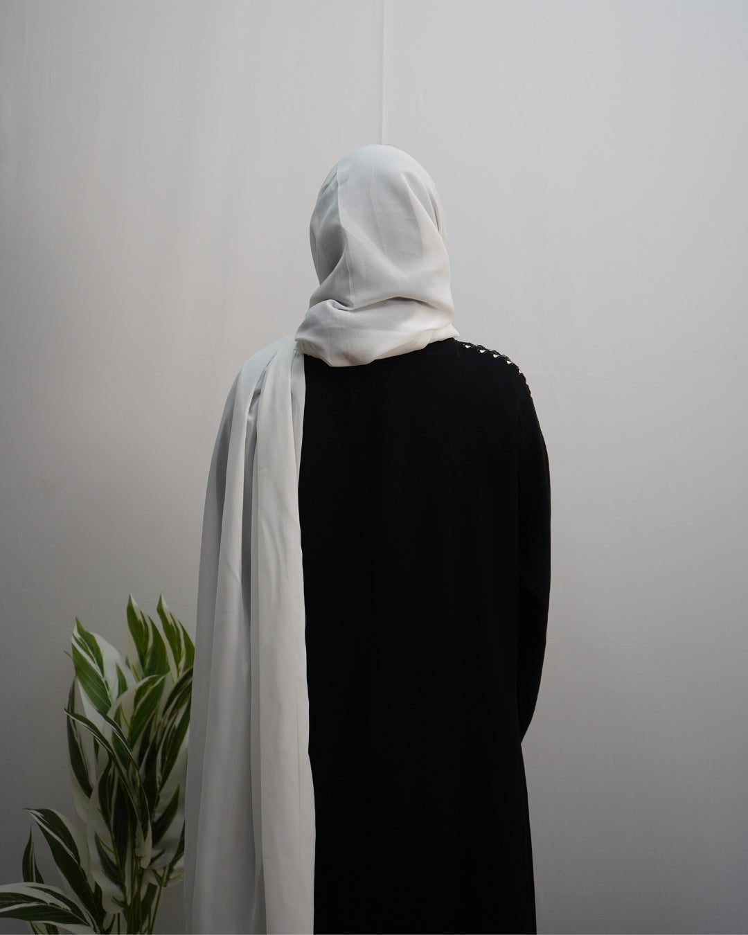 Lightweight white indian chiffon hijab with stitched edges and graceful drape.