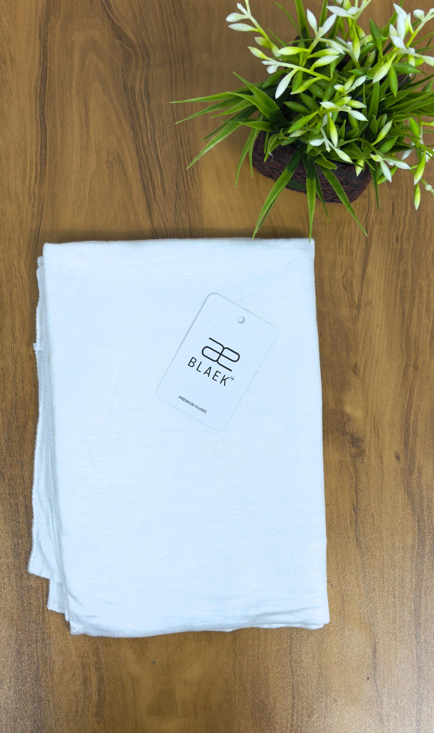 Stretchy and comfortable white jersey hijab for a snug fit.