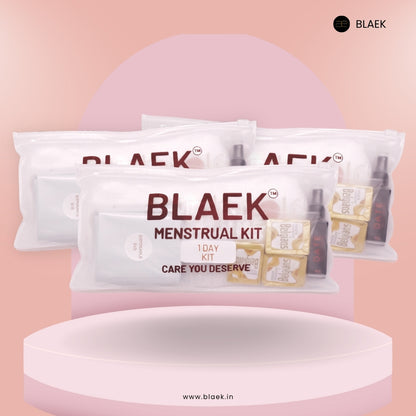 Front view of Three 1 day Period Kits with sanitary pads, wet wipes, chocolates, and accessories.