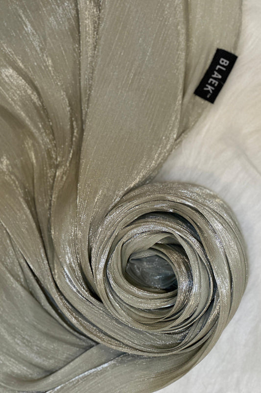 Artichoke Shimmer Hijab arranged in a round swirl to highlight soft shimmer.