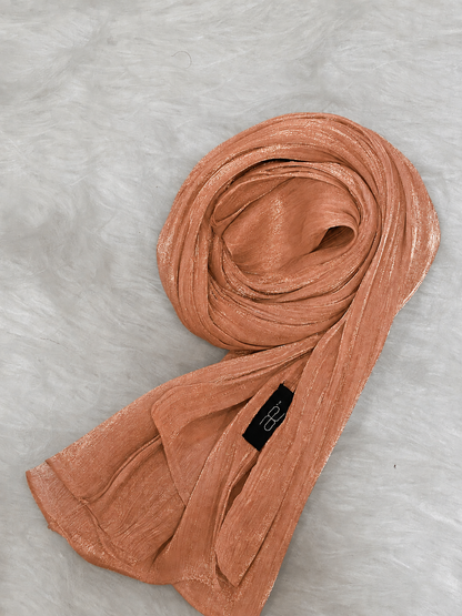 Atomic Tangerine shimmer hijab with soft textured lightweight fabric.