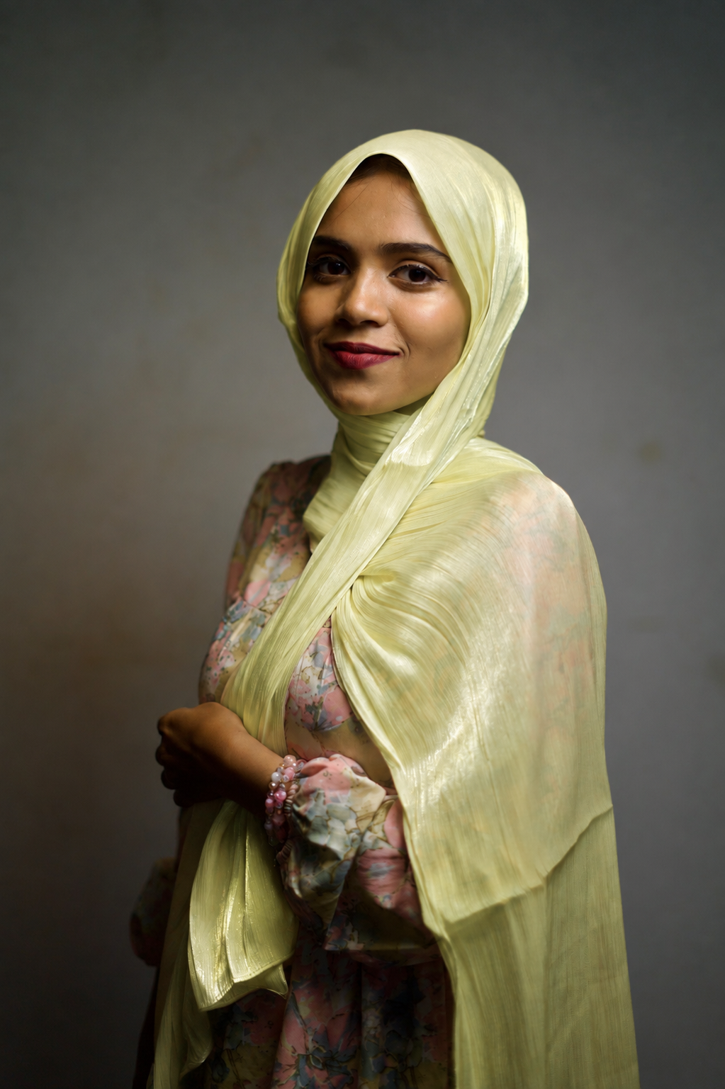 Woman wearing Australian Mint shimmer hijab with elegant draped styling