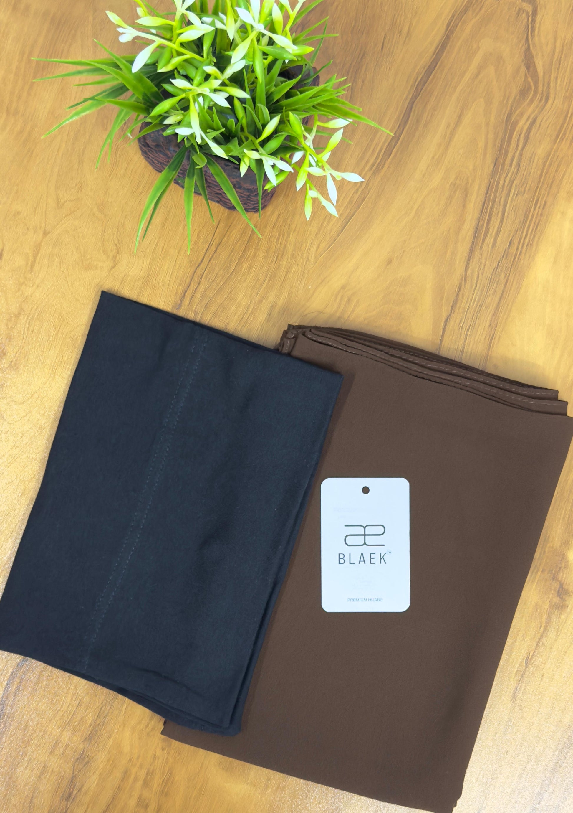 Light mocha hijab with a deep black cap for a timeless style.