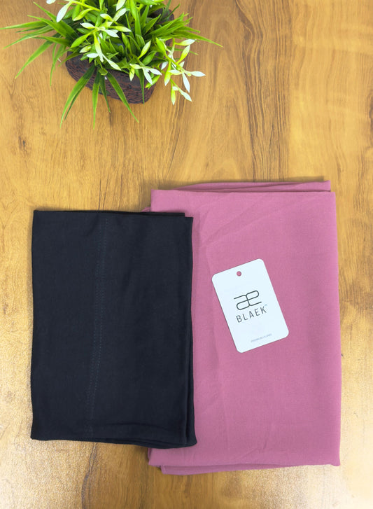 Soft puce hijab accented by a classic black cap for everyday elegance.