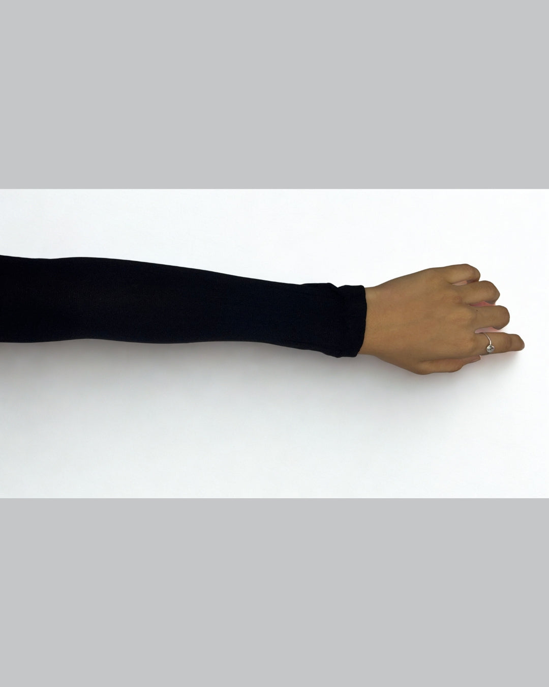 Black stretchable sleeve extender for women – provides full arm coverage under dresses and tops.