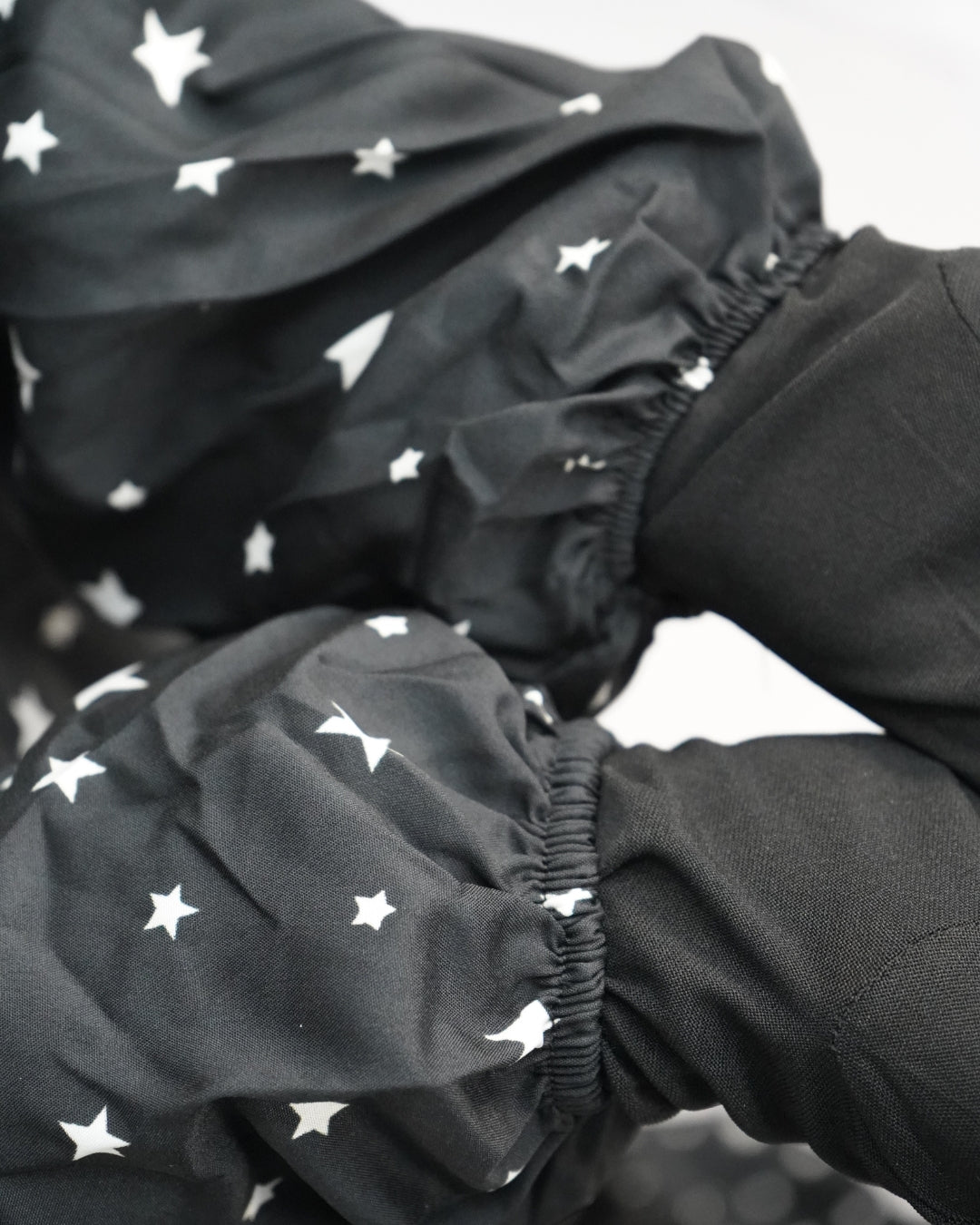 Modest prayer dress in polyester lycra with star print sleeve close-up.