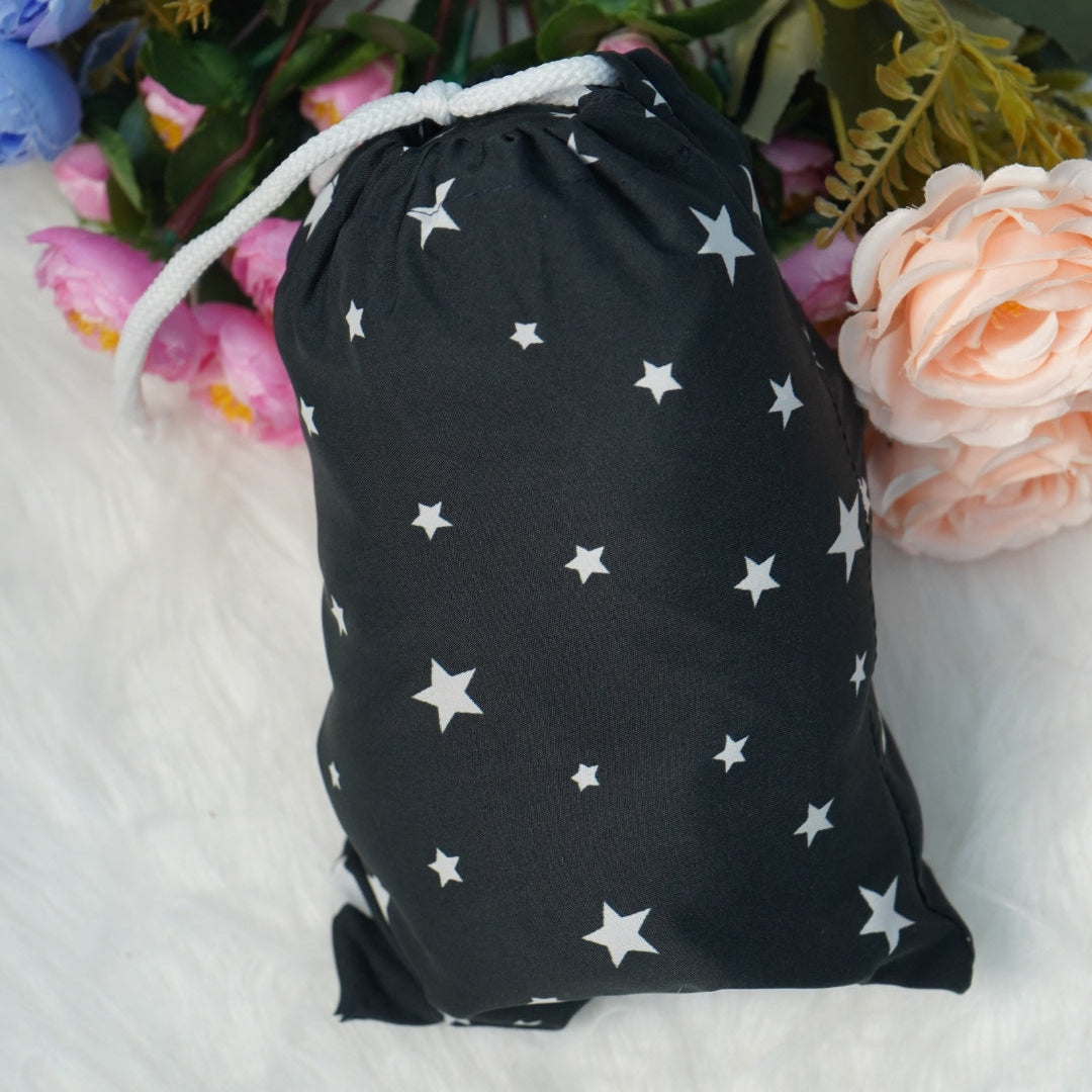 Matching black star print pouch included with prayer dress.