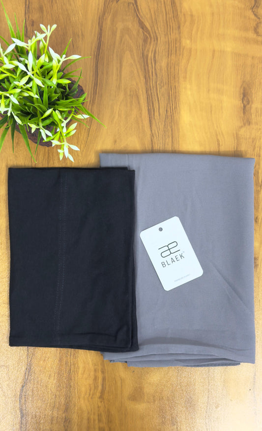 Soft smoke hijab paired with a black cap.