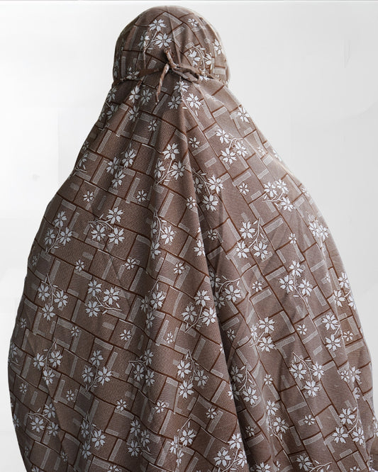 Back view of brown floral prayer dress with tie-back and full coverage.