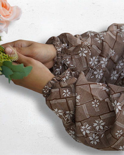 Elasticated cuff detail of brown floral polyester lycra prayer dress for comfortable fit.