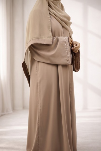 A woman elegantly wearing the Tiktok Indonesian Abaya, showcasing its beautiful drape and comfortable fit.
