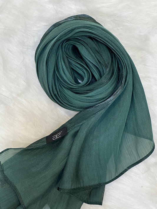Round swirl of Brunswick green chiffon hijab showing light shimmer.