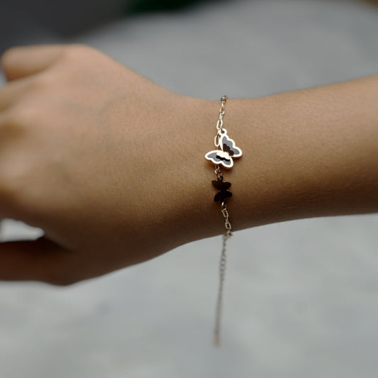 Delicate butterfly bracelet with an adjustable chain and elegant charm.