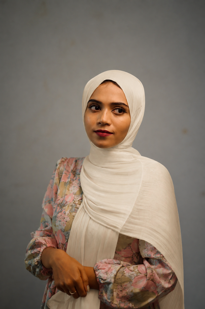 Woman wearing Cannoli Cream shimmer hijab in a soft draped style
