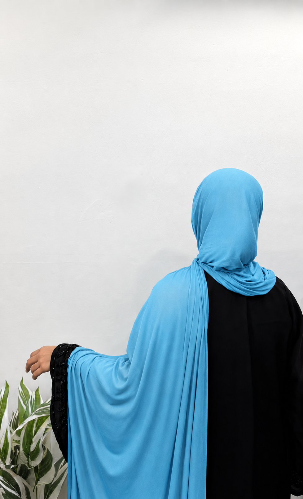 Woman wearing a Contact Blue Jersey Hijab with soft drape and full coverage
