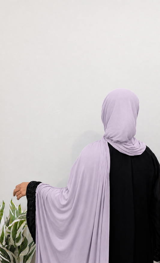 Woman wearing a Dusky Lilac Jersey Hijab with soft drape and full coverage