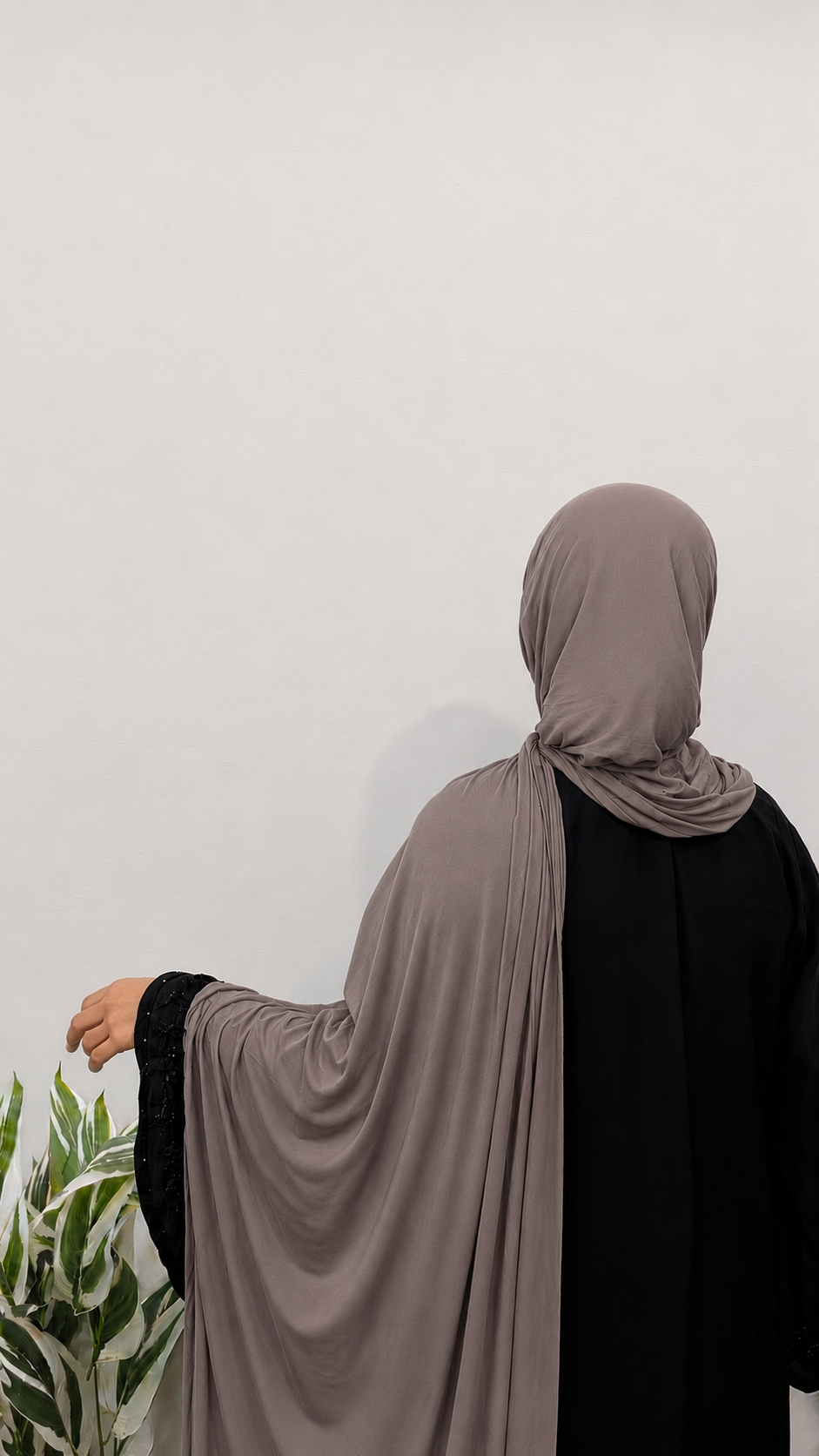 Woman wearing a Faded Brown Jersey Hijab with soft drape and full coverage