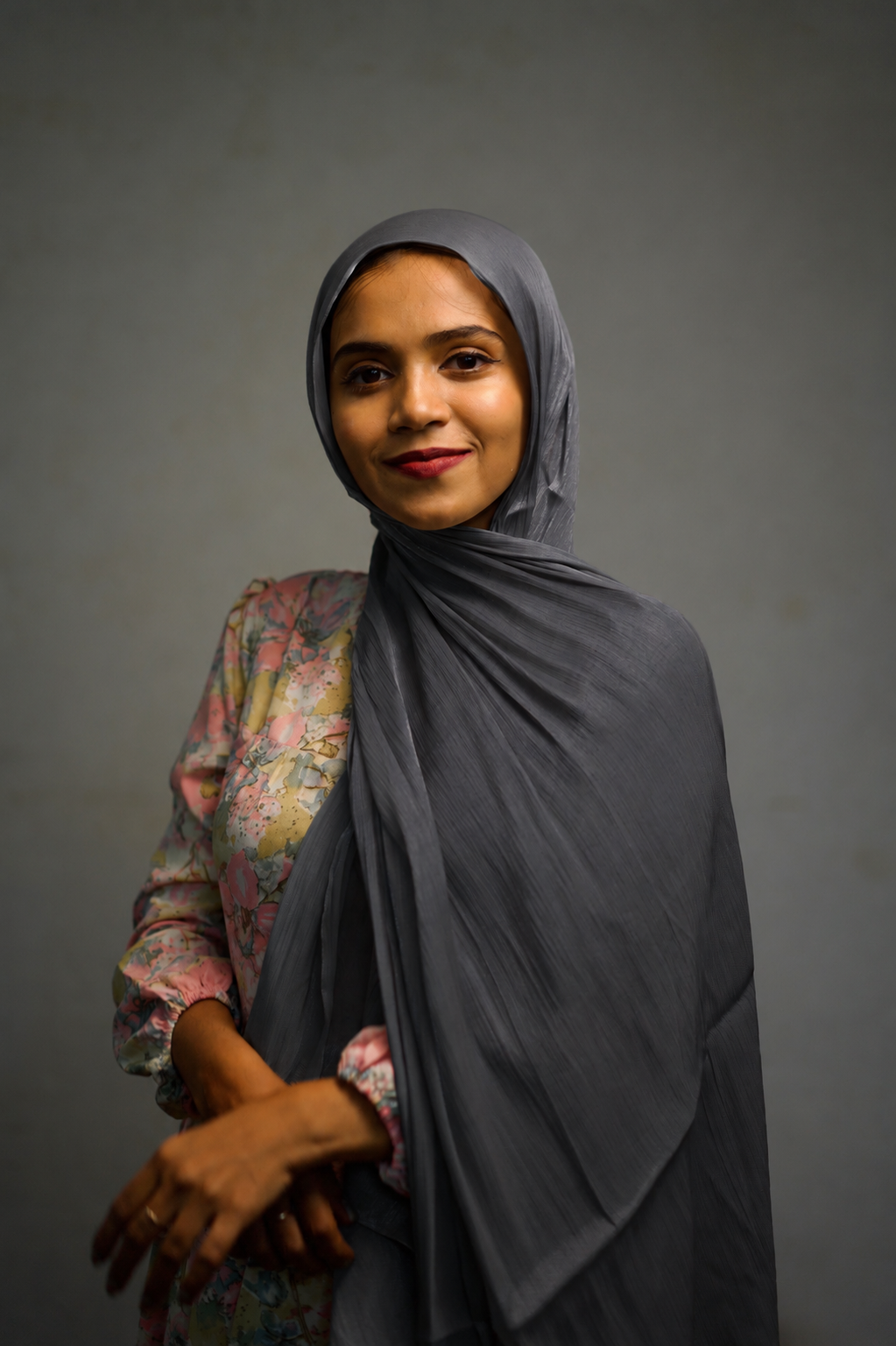Woman wearing Graphite shimmer hijab in a simple draped style