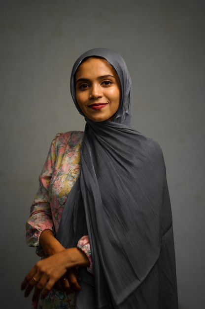 Woman wearing Graphite shimmer hijab in a simple draped style