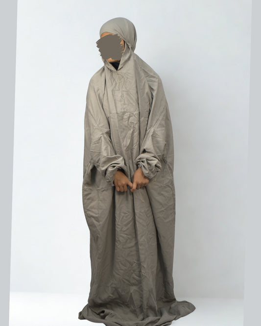 Woman wearing full-length gray polyester lycra prayer dress.