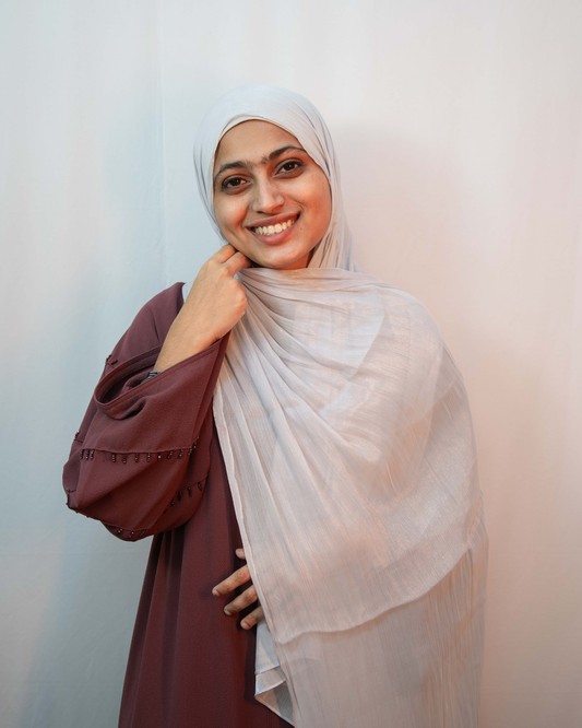 Ice blue shimmer hijab worn by model soft lightweight modest scarf with elegant shine