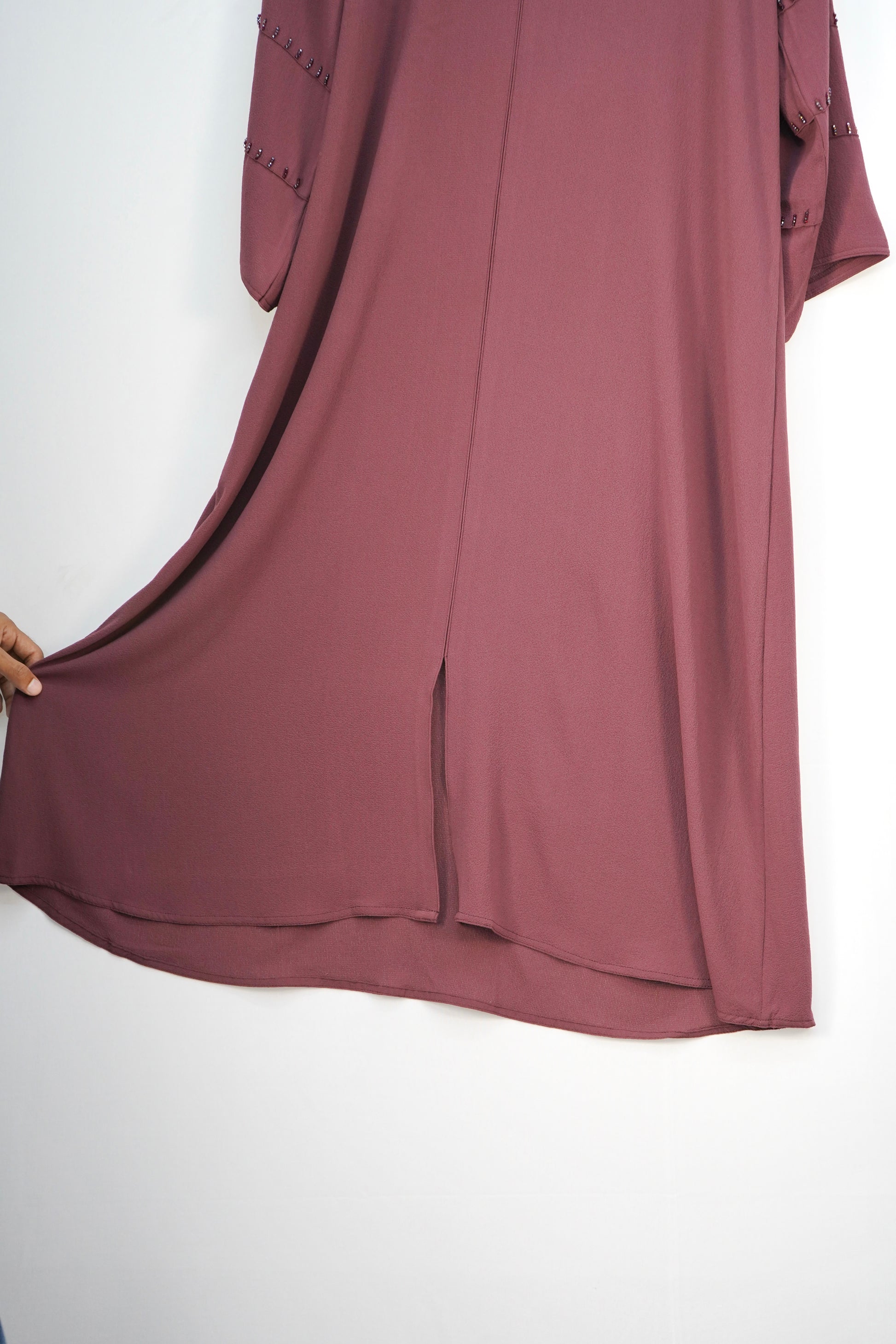 A close-up of the Old Mauve bubble-textured fabric, showing its unique texture and color.