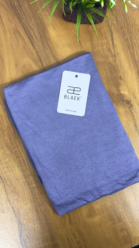 Compactly folded lavender hijab in premium jersey material.