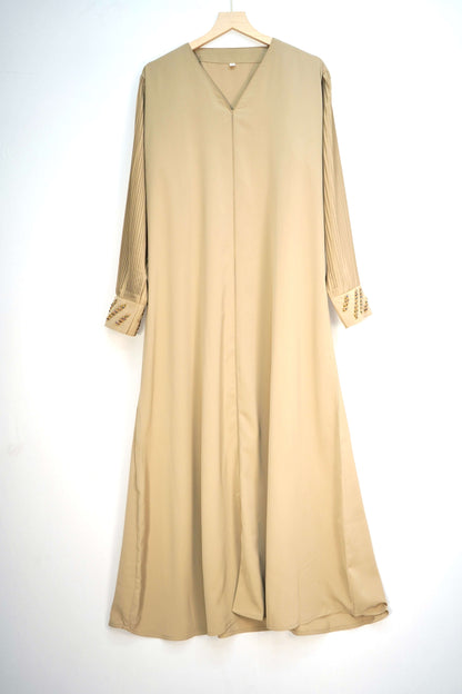  full shot of the abaya hanging, showing its color and design.