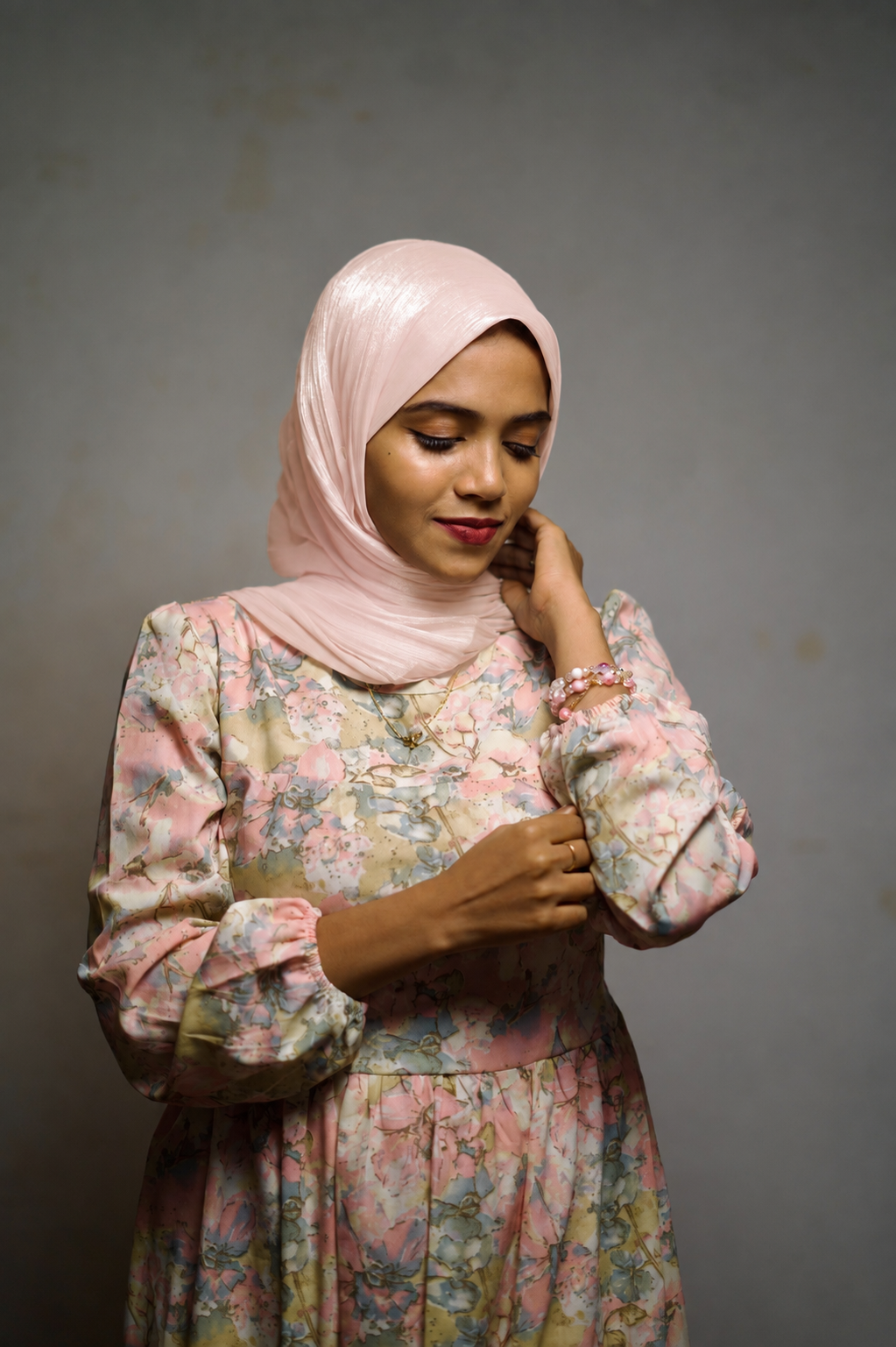 Woman wearing Light Salmon shimmer hijab in a neat wrapped style