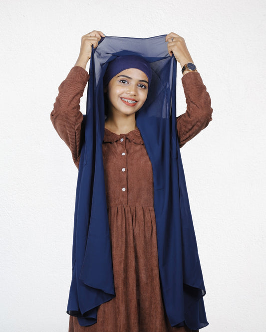 Navy Blue Instant Hijab worn with attached cap showing at the forehead.