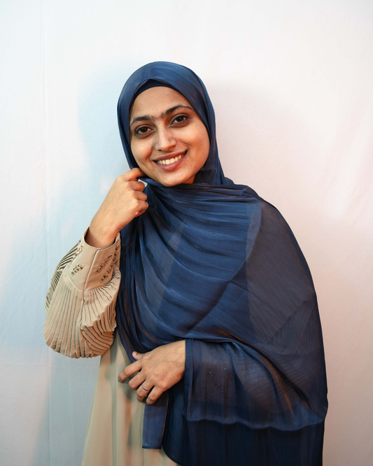 Model wearing navy blue shimmer hijab lightweight elegant modest scarf front view