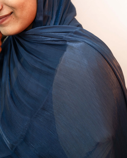 Close up of navy blue shimmer hijab showing smooth fabric texture and shine