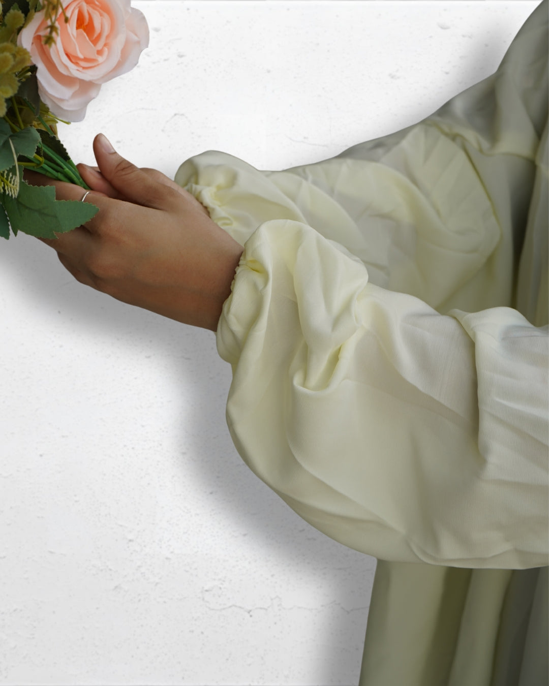 Elastic cuff detail of off white modest Islamic prayer dress sleeve.