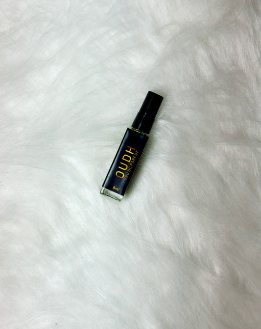 Oudh Perfume 8ml arranged flat with cap closed on a white backdrop.