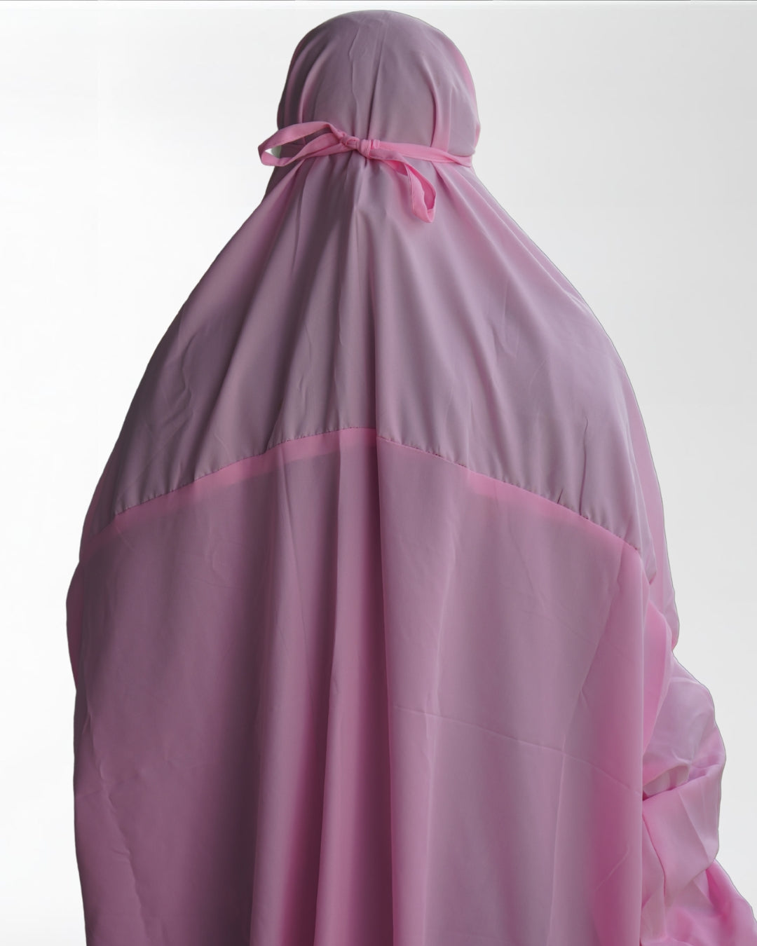Solid pink polyester lycra prayer dress back view with adjustable tie.