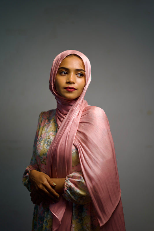 Shimmer hijab in a pink tone, draped gently and evenly.