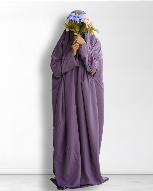 Solid purple prayer dress full length front view with floral bouquet.