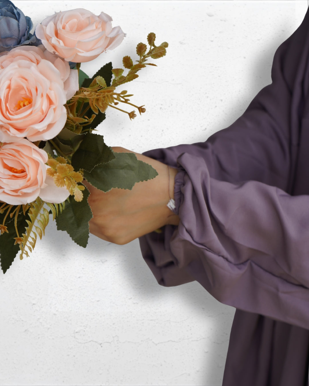 Elastic cuff detail of solid purple modest prayer dress sleeve.