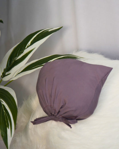 Matching solid purple pouch for Islamic prayer dress.
