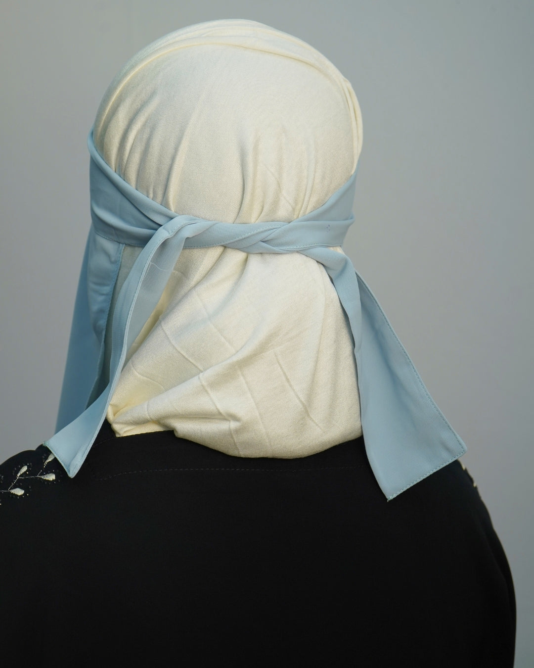 Back view of sky blue crepe chiffon niqab with long straps.