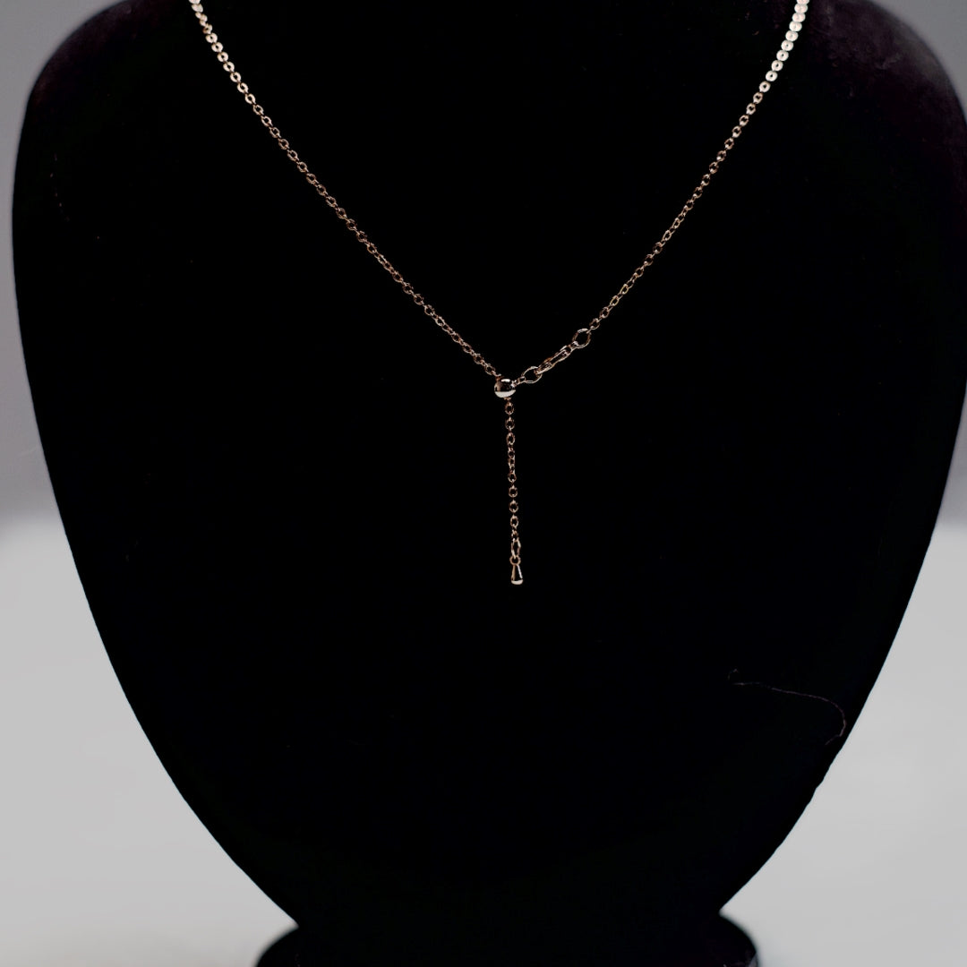 Rose gold stone drop chain necklace with five clear crystal teardrops.
