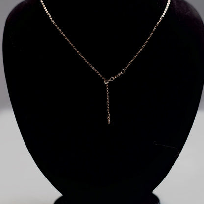 Rose gold stone drop chain necklace with five clear crystal teardrops.