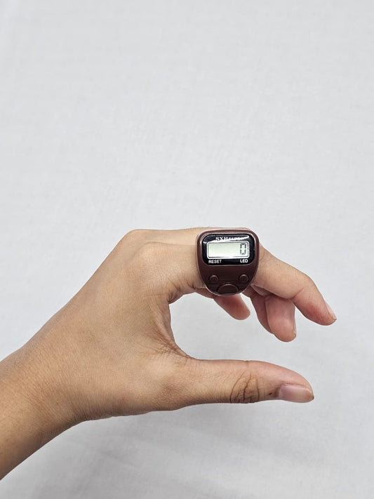 Brown plastic digital tasbeeh counter with fixed plastic finger strap.