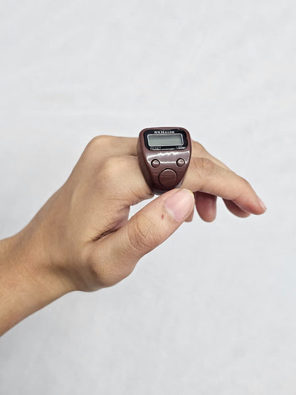 Digital LED tasbeeh counter in brown plastic with reset and count buttons.