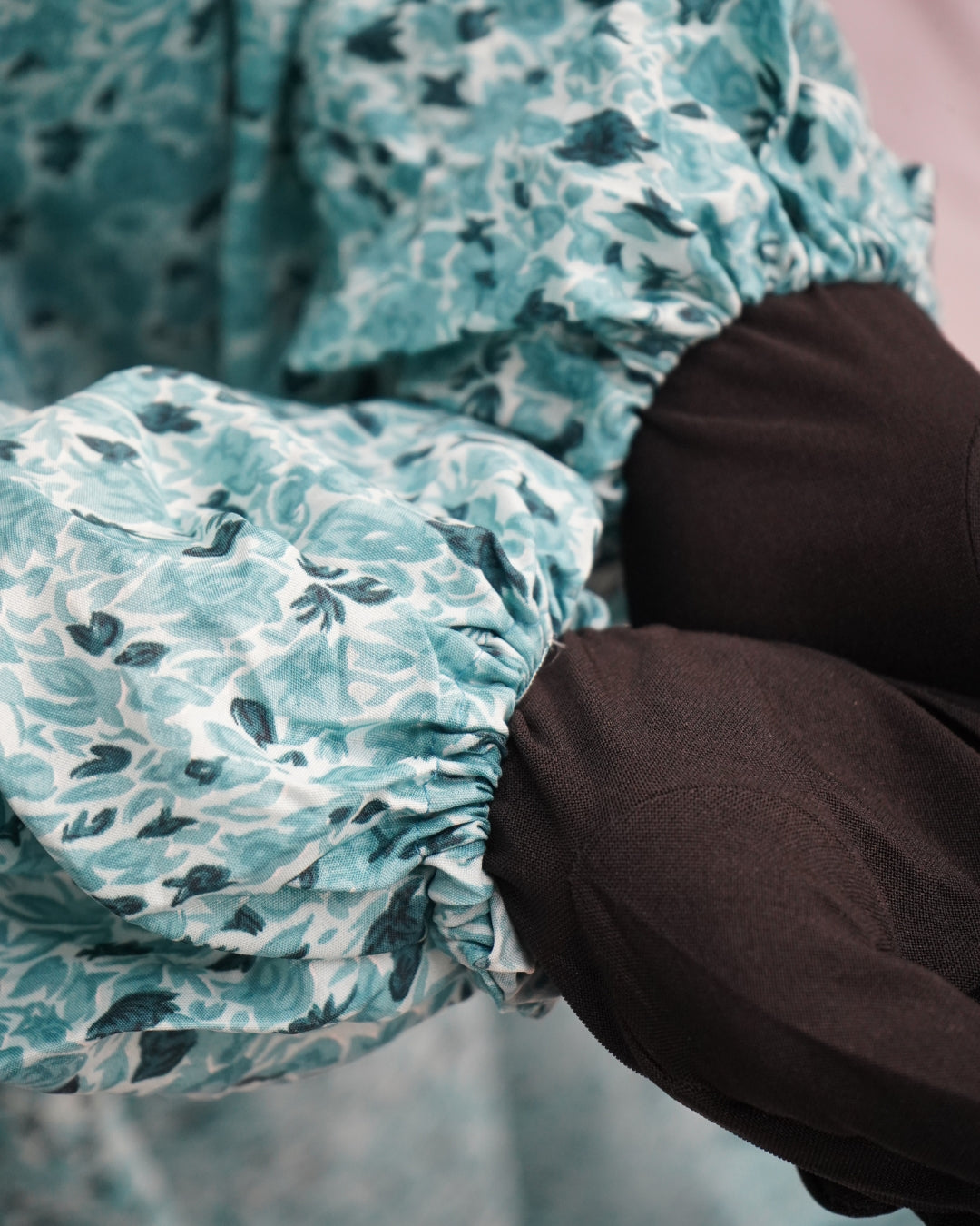 Sleeve detail showing elastic cuffs of teal green prayer dress.