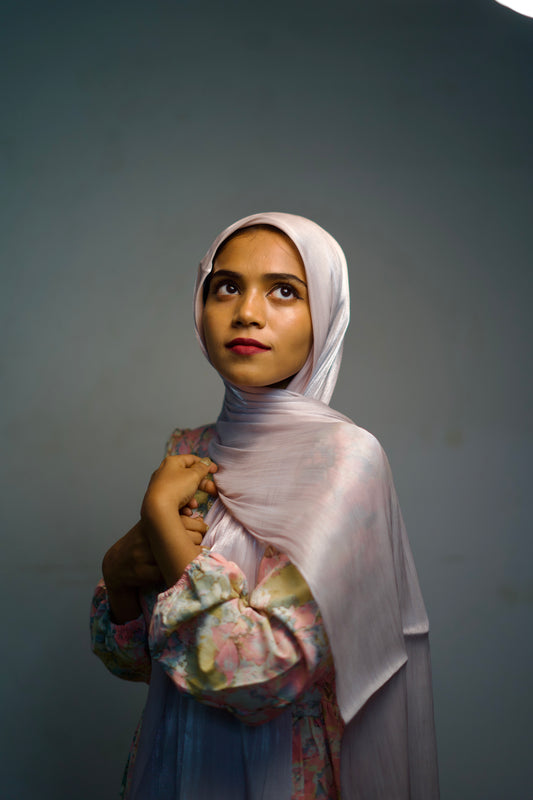 Thistle Shimmer Hijab worn with a soft wrap and a gentle glow.